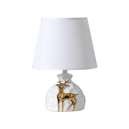 Elegante Tischlampe Gold mit Keramikbasis und natürlichen Hirschdetails