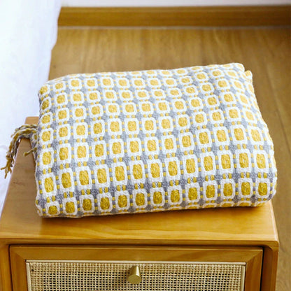 Gestrickte Couchdecke mit Quasten