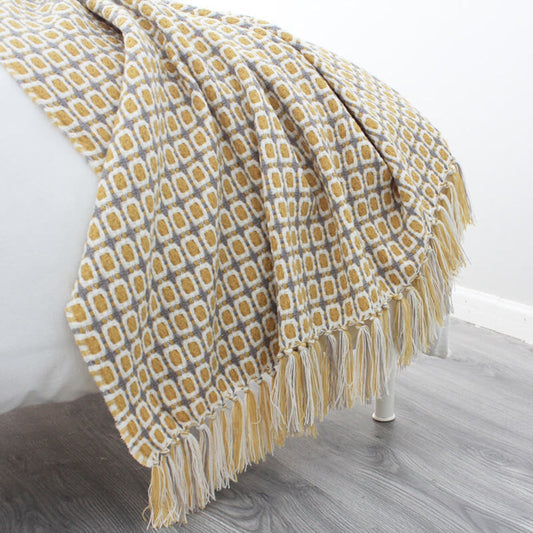 Gestrickte Couchdecke mit Quasten