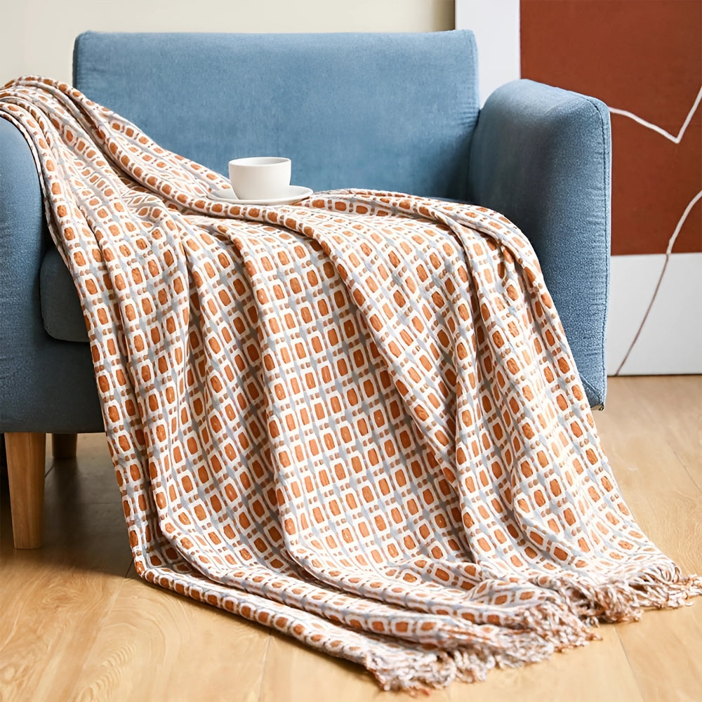 Gestrickte Couchdecke mit Quasten