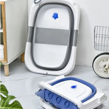 Faltbare Babybadewanne mit rutschfestem Kissen und integriertem Thermometer.