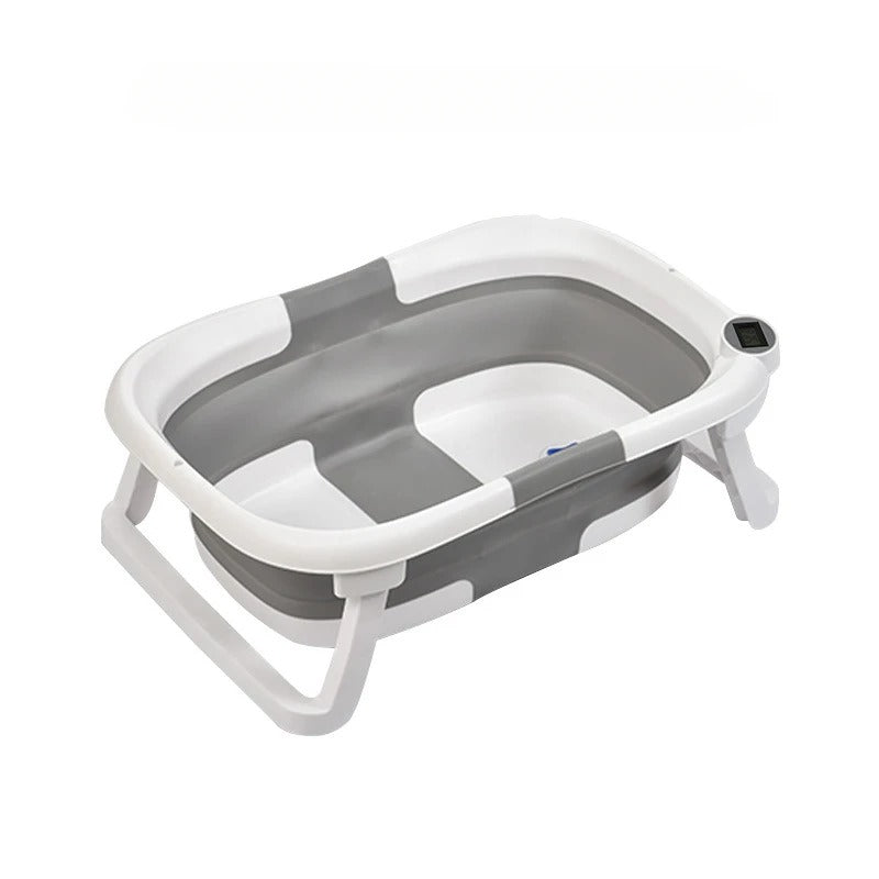 Faltbare Babybadewanne mit rutschfestem Kissen und integriertem Thermometer.