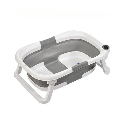 Faltbare Babybadewanne mit rutschfestem Kissen und integriertem Thermometer.