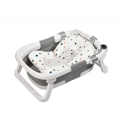 Faltbare Babybadewanne mit rutschfestem Kissen und integriertem Thermometer.