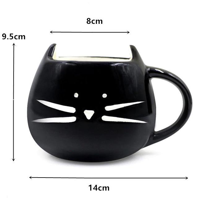 Kaffeetasse mit Löffel und Katzenmotiv