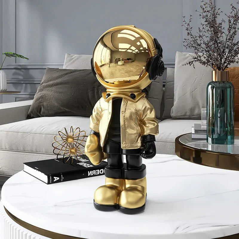 CosmoLuxe – Elegante Astronautenstatue mit goldenen Akzenten