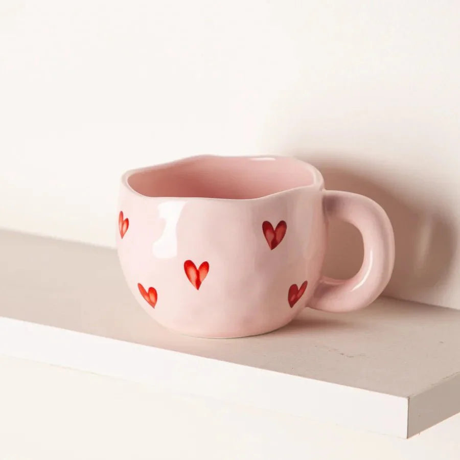 Kaffeetasse aus Keramik mit rosa Herz